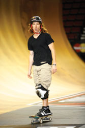 Shaun White rolling out of the half-pipe at the Dew tour in Portland, OR. &copy; Peter Kim - Dreamstime.com