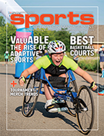 Young athlete in a racing wheelchair, exuding determination, participates in an outdoor event. The magazine cover highlights adaptive sports.