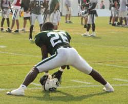 New York Jets Cornerback, Lito Sheppard, stretches before training at SUNY Cortland, NY during training camp in 2009. &copy; Kathleen Handy - Dreamstime.com