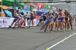 Inline speed skating techniques, in many ways, resemble those used in bicycle racing. Skaters, like cyclists, will move in a pack, and will "draft" to lower air resistance. Note the plastic cones used to delineate the race course. Photo courtesy of MMJ.