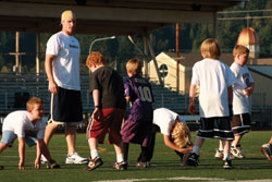 St. Louis Rams' Dan Looker involved in parks and recreation youth football camp for kids grades 1 to 8. &copy; Molly Williams - Dreamstime.com