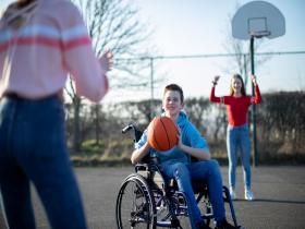 Wheelchair basketball players enjoying game