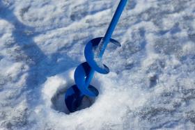 Ice Fishing Auger and Hole Recently Bored