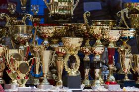 As sports tourism grows, more medals, trophies, ribbons and plaques are being handed out than ever, meaning parents are faced with an ever-expanding amount of hardware that gathers dust. How can event owners help ease the glut and increase the feel-good factor? By partnering with an award-specific recycling program. Here’s how to win the green game.