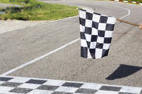 Checkered flag at start of motorsports race