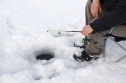 Ice Fishing Auger and Hole Recently Bored