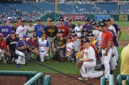 : Both teams in the 2017 Congressional Baseball Game for Charity posed for a photo. Image courtesy of repmobrooks, CC BY-SA 2.0 via Wikimedia Commons 