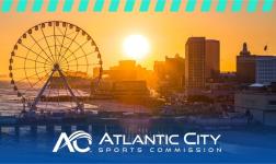 Sunset view of Atlantic City boardwalk with Ferris wheel and city buildings, featuring the Atlantic City Sports Commission logo at the bottom.