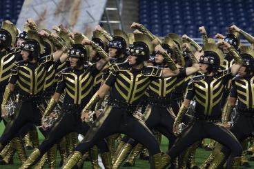 Summertime means movie theaters crowded with the latest action flicks and kids’ entertainment. It is not generally the venue to watch a marching band competition – despite the fact that high school band is bigger than ever. But Drum Corps International has found a way to bring its high-energy show to those who can’t make its nationwide tour. 