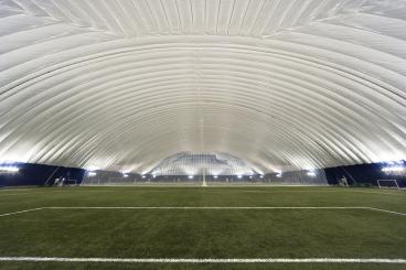 Under Domes and in Former Colleges, Sports Facility Development Innovations