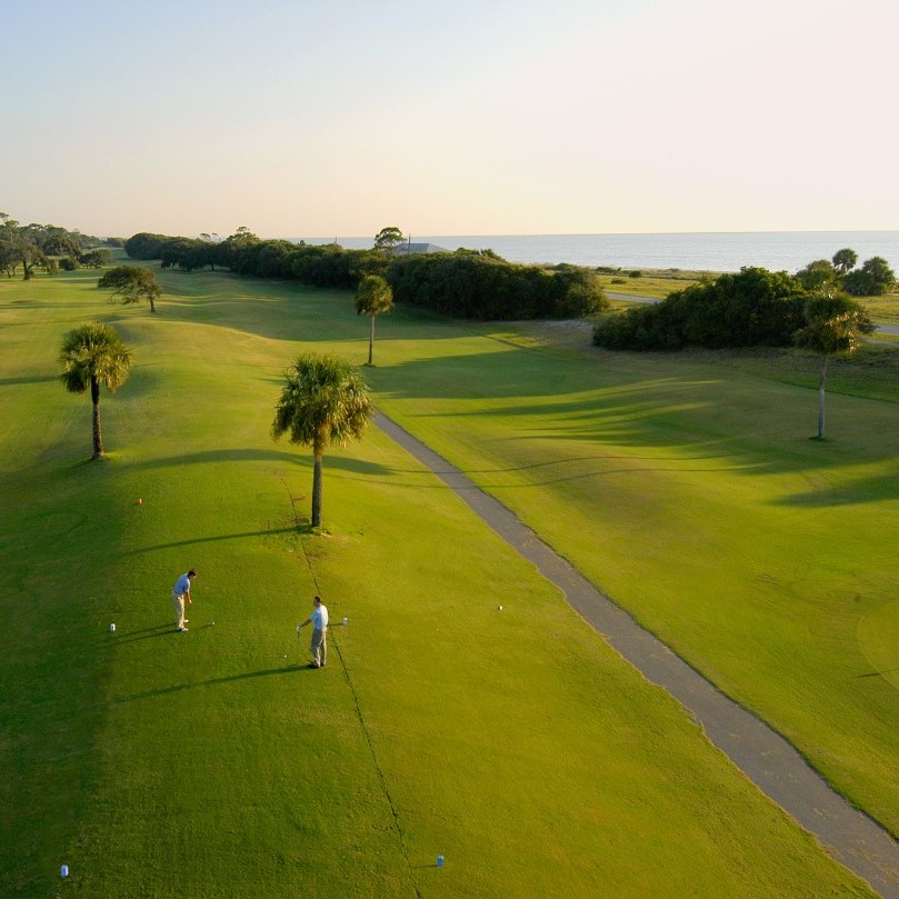 Luxury Golf Resort with Golfer Trying Skills in the Foreground