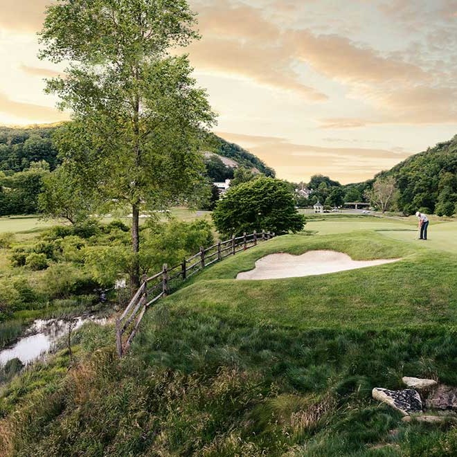 Luxury Golf Resort with Golfer Trying Skills in the Foreground